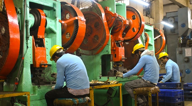 Power press machine shaping sheet metal with die and punch